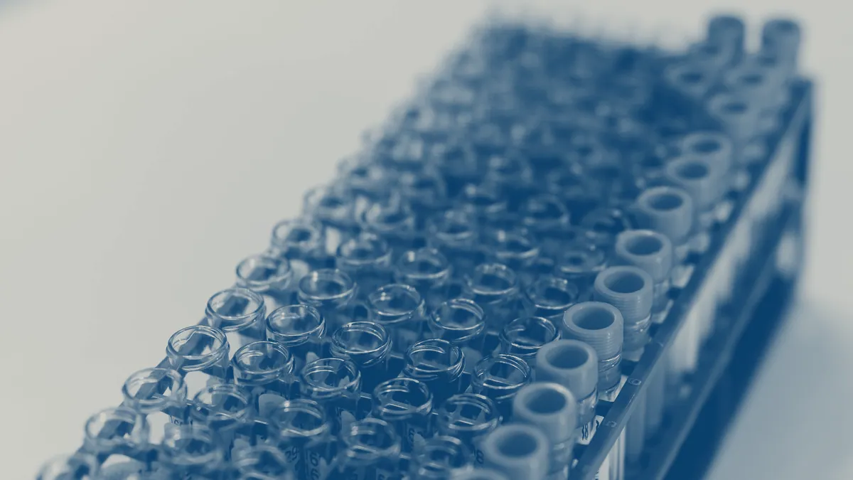 A rack of identical, unlabelled tubes.