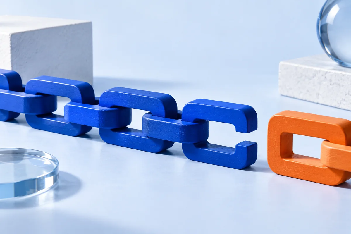 A chain of geometric blocks with a missing connection. AI-created editorial illustration.